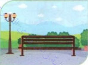A park with a bench and a street lamp